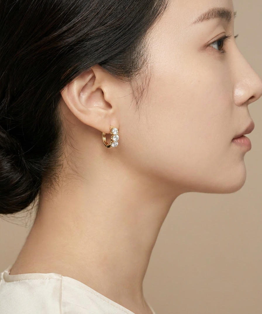 Campanula Huggie Hoops worn by model