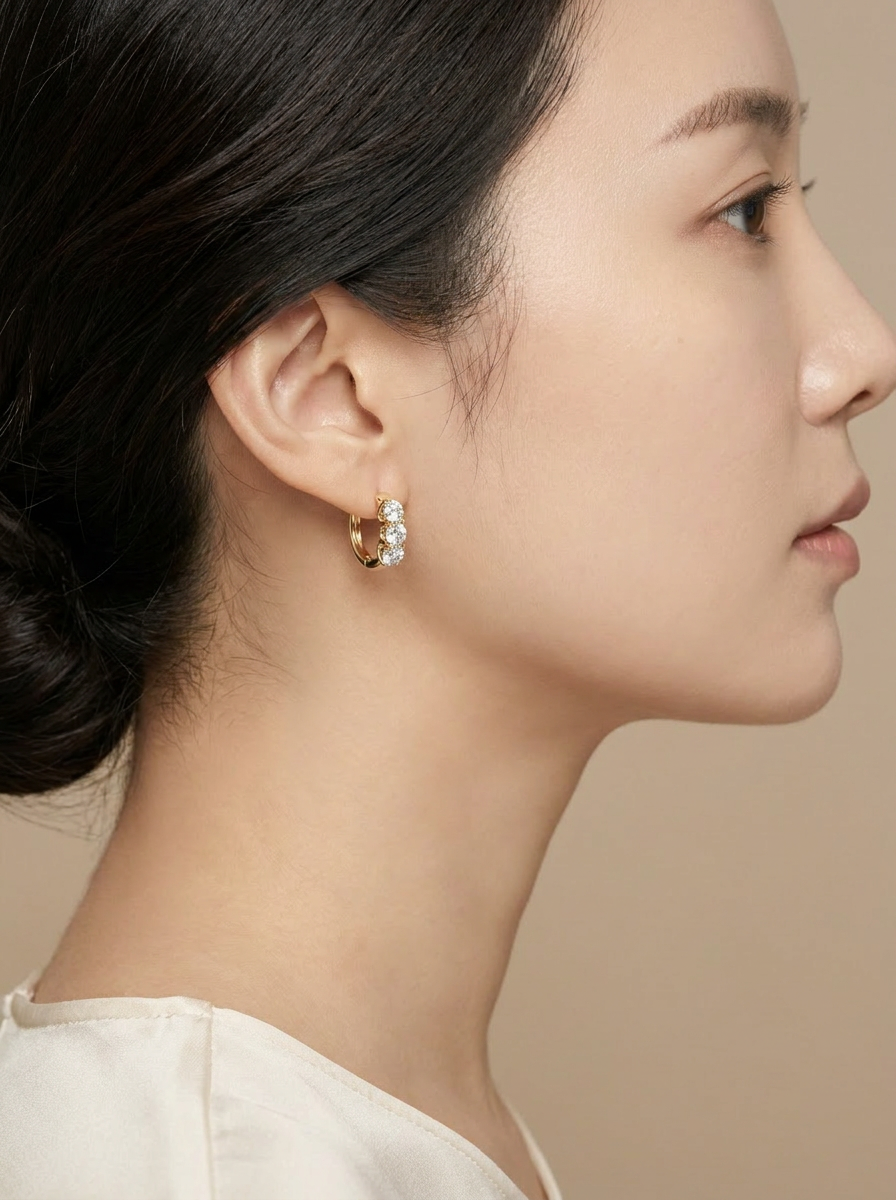 Campanula Huggie Hoops worn by model