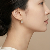 Campanula Huggie Hoops worn by model