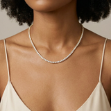 Honeysuckle Tennis Necklace worn — uniform prong-set round brilliants in yellow gold
