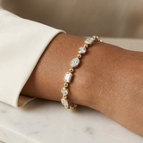 Rosemary Tennis Bracelet worn by model — bezel-set mixed-cut diamonds in yellow gold