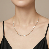 Saffron necklace worn — mixed-cut bezel-set diamonds in yellow gold