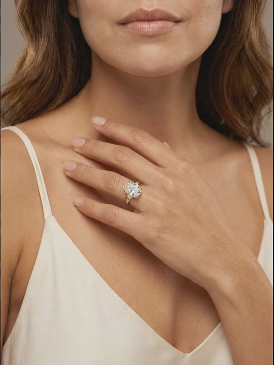 Cyclamen Solitaire Ring worn — cushion-cut diamond on a plain gold band