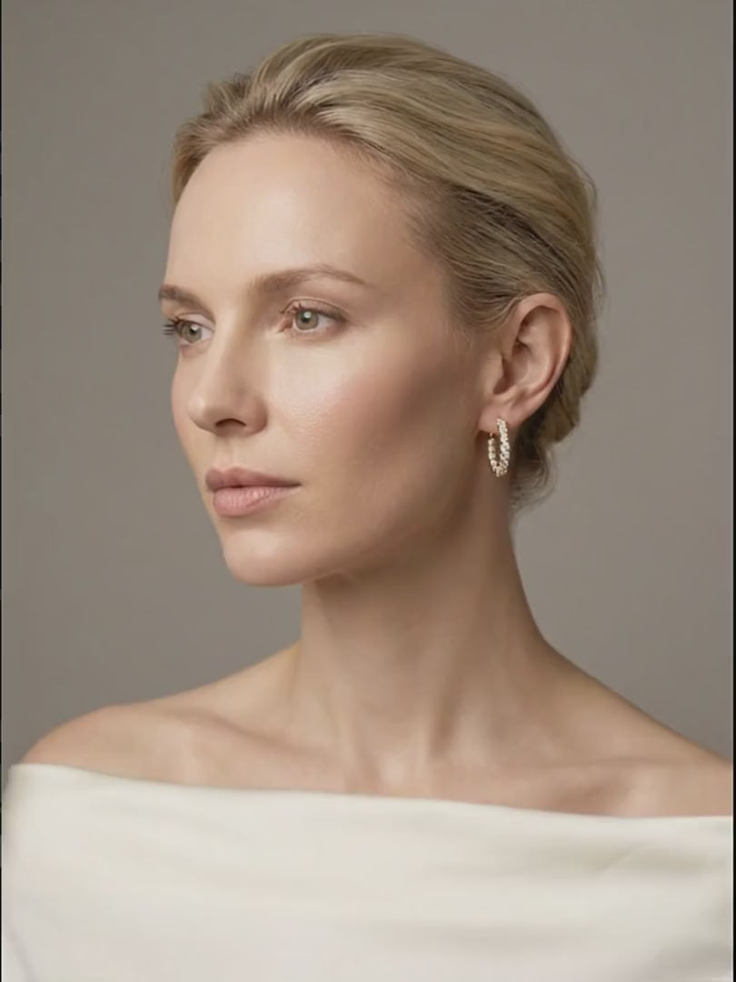 holly-diamond-hoops worn by model, she slowly turns her head so the hoop earring catches the light